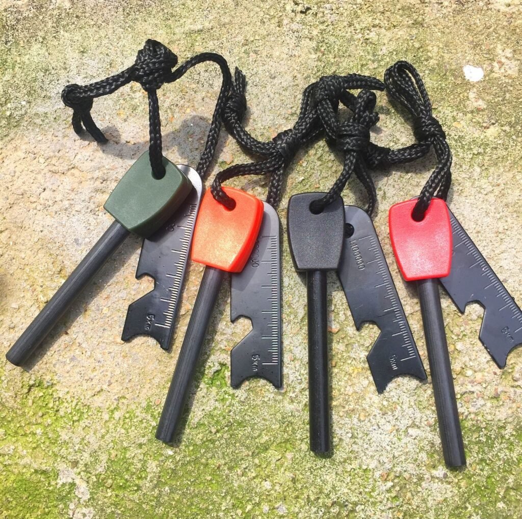 ferro rod bulk FRC53 solutions displaying multiple color options including black, orange, and army green plastic handles with matching steel strikers.