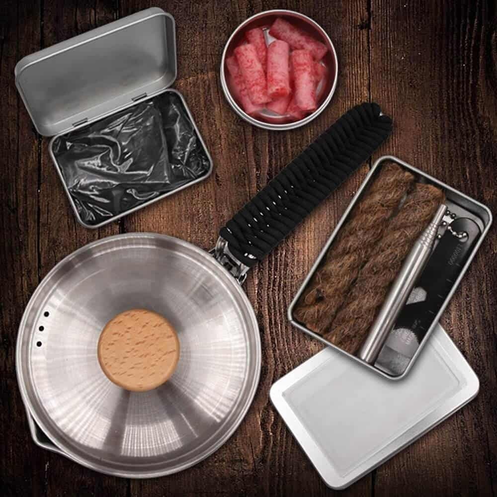 Professional-grade survival kit including a high-output ferro rod bulk FRC23, a telescopic pocket bellow, and a paracord-wrapped stainless steel pot, perfect for wholesale ferro rod distribution.