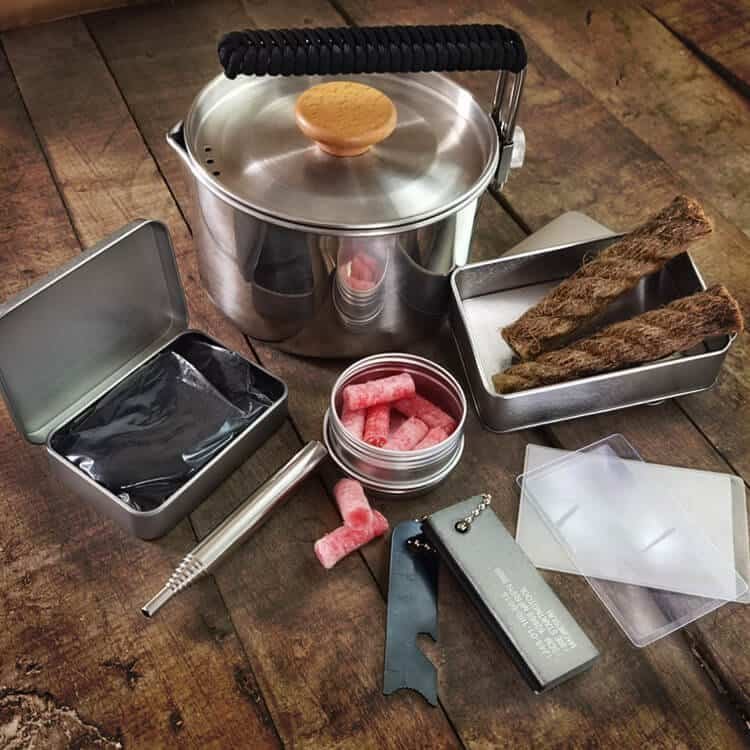 Professional-grade survival kit including a high-output ferro rod bulk FRC23, a telescopic pocket bellow, and a paracord-wrapped stainless steel pot, perfect for wholesale ferro rod distribution.