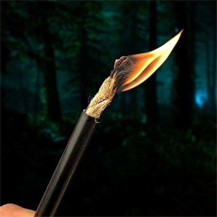 Starting a campfire in wet conditions using FRC13 fatwood kindling and a professional Ferro Rod Bulk FRC13 striker set.