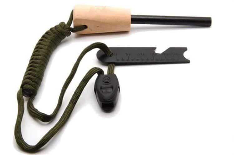 Close-up of bulk ferrocerium rods with ergonomic natural wood handle and 550 paracord lanyard for professional survival gear.