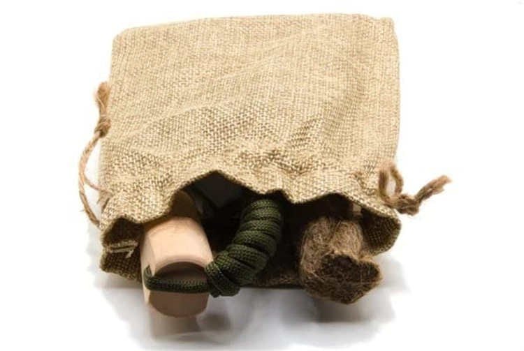 Retail-ready burlap drawstring pouch containing the ferro rod bulk FRC08 kit for outdoor brands and wholesalers.