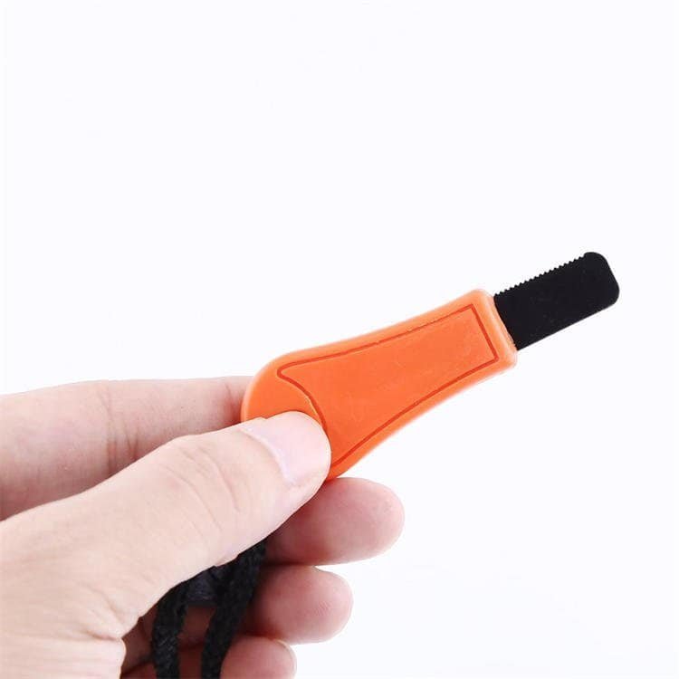 Close-up of holding the FRC26 wholesale tactical ferrocerium rods fire starter, perfect for private-label outdoor brands.