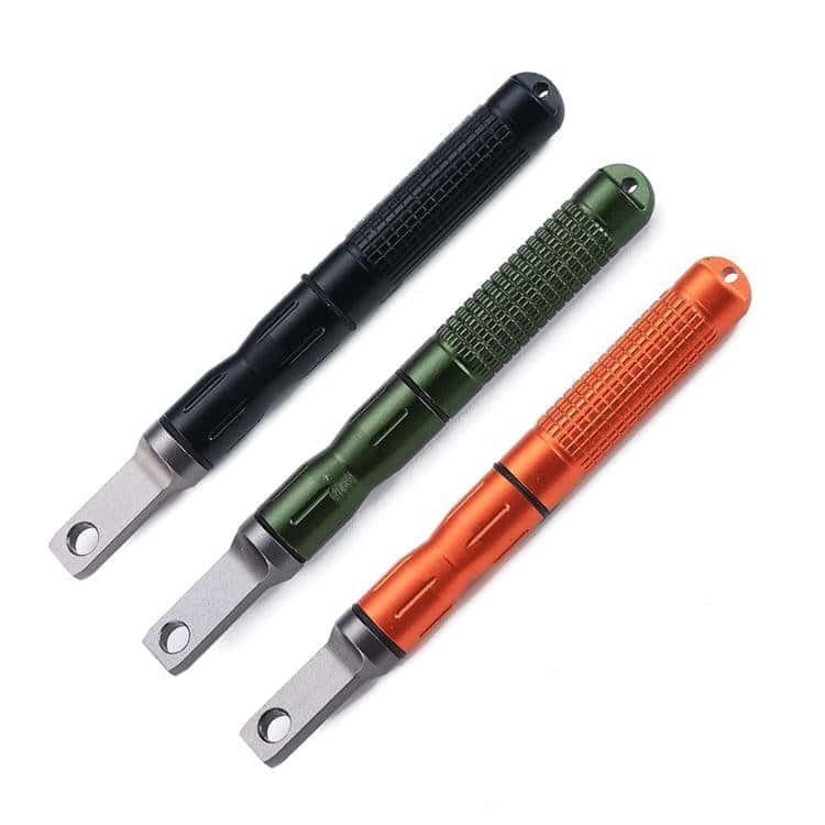 Premium wholesale ferro rod fire starters in black, orange, and green anodized aluminum housings for outdoor survival gear.
