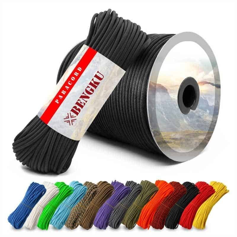 PRD02 100ft black 550 paracord bundle and large spool next to a variety of colorful wholesale paracord options for outdoor brands.