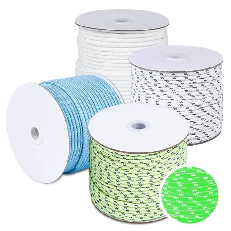 5mm luminous rope spools in green, blue, and white showing reflective stripes and a plump inner core, supplied by a leading bulk paracord manufacturer.