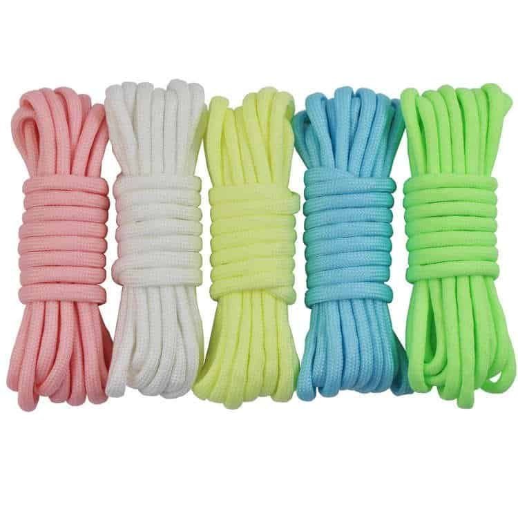Five bundles of colorful glow-in-the-dark utility ropes in pink, white, yellow, blue, and green, supplied by a professional paracord manufacturer.