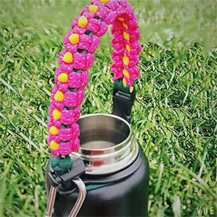 PH04 flower braided paracord bottle handle securely attached to a wide mouth insulated water bottle