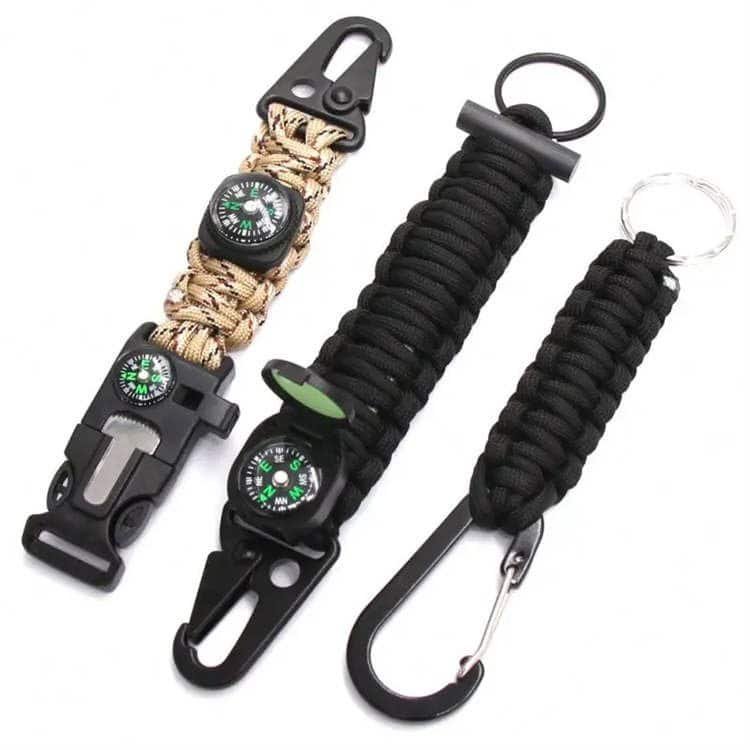 Close-up of heavy-duty weave, carabiner clip, and compass components from an OEM paracord manufacturer using durable bulk paracord.