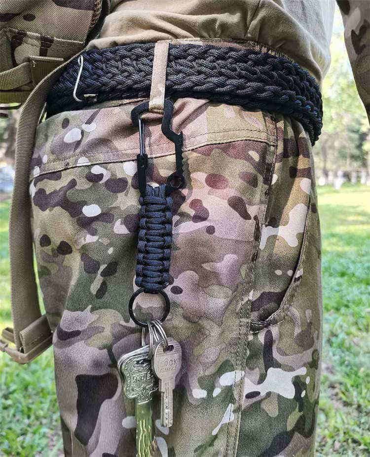Side view of PK04 tactical paracord supplies keychain attached to trousers