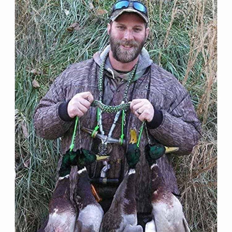 Hunter using a heavy-duty wholesale paracord lanyard to securely carry calls and harvested waterfowl in the field.