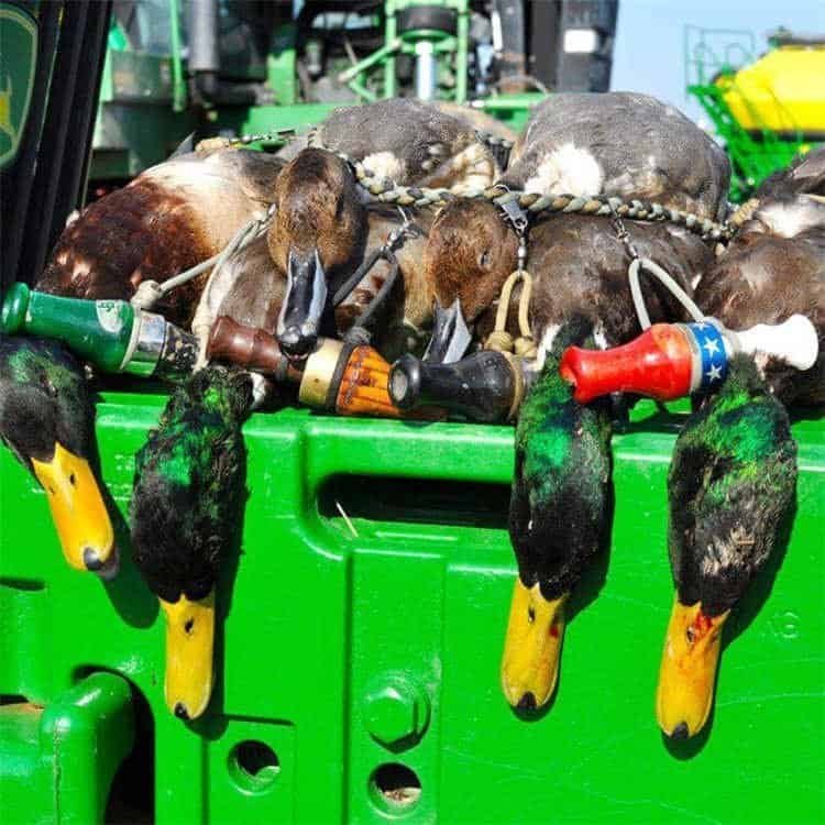 PL07 paracord lanyard bulk in action holding multiple waterfowl calls and game in outdoor hunting setup