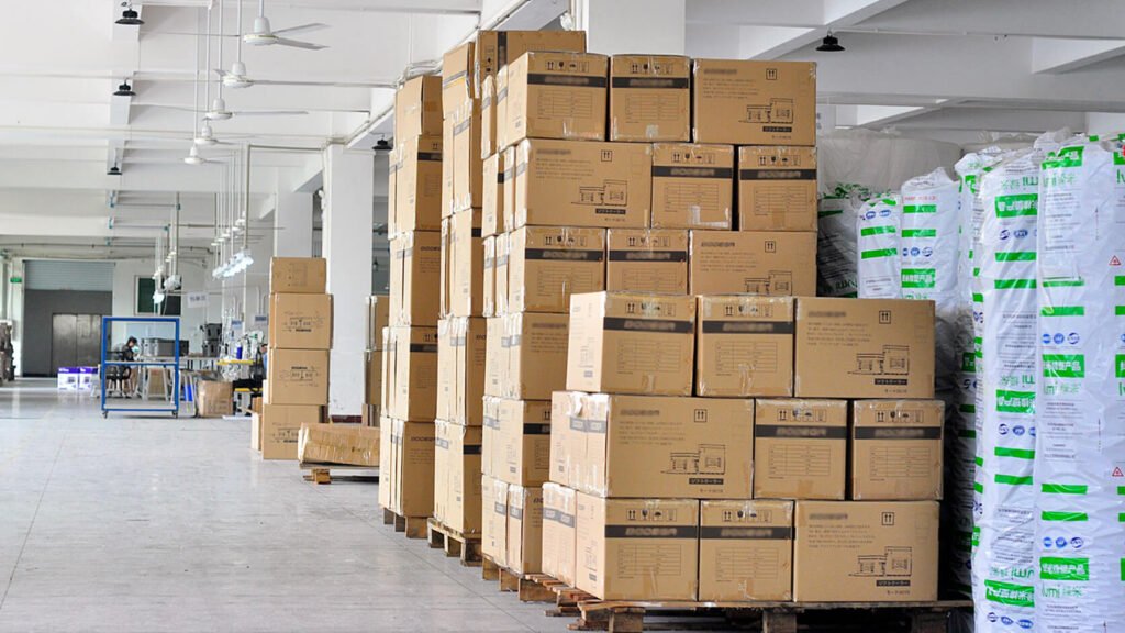 Stacked cardboard shipping cartons in the factory warehouse